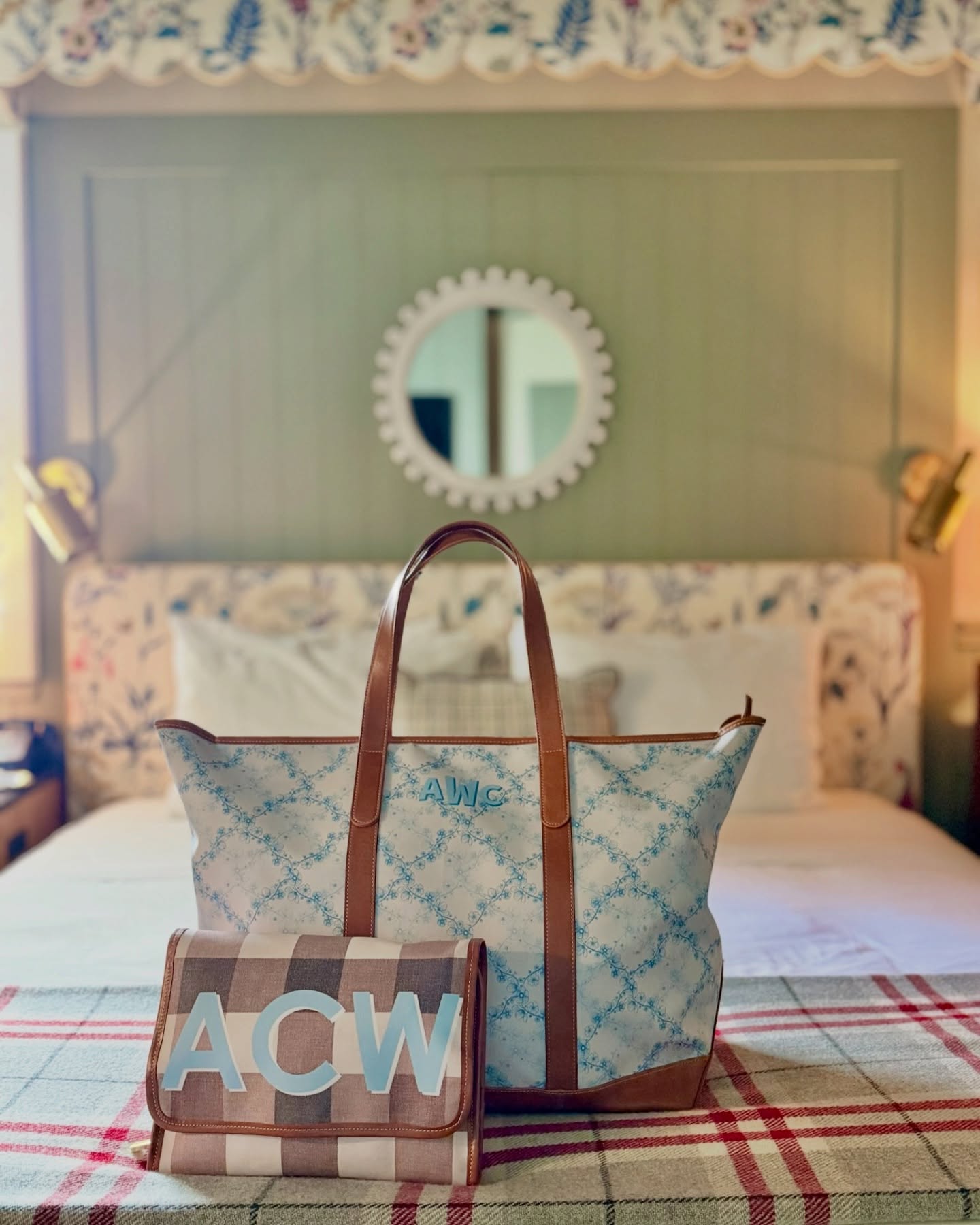 Monogrammed Tote Bags: Our extra large plaid tote with leather handles, perfect for weekend getaways, displayed in a bedroom setting.