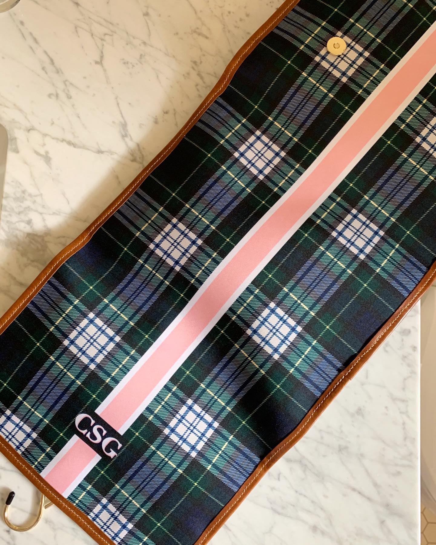 Elegant plaid hanging toiletry bag with personalized monogram showcasing attention to detail.