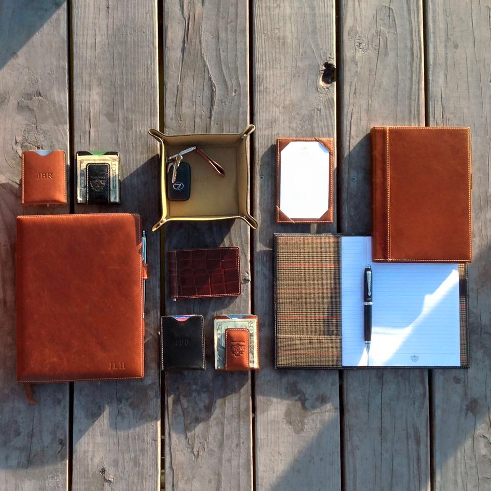 Leather money clip by Barrington Gifts, an overhead view showcasing its British tan color and quality alongside other accessories from our money clips collection, highlighting product benefits.