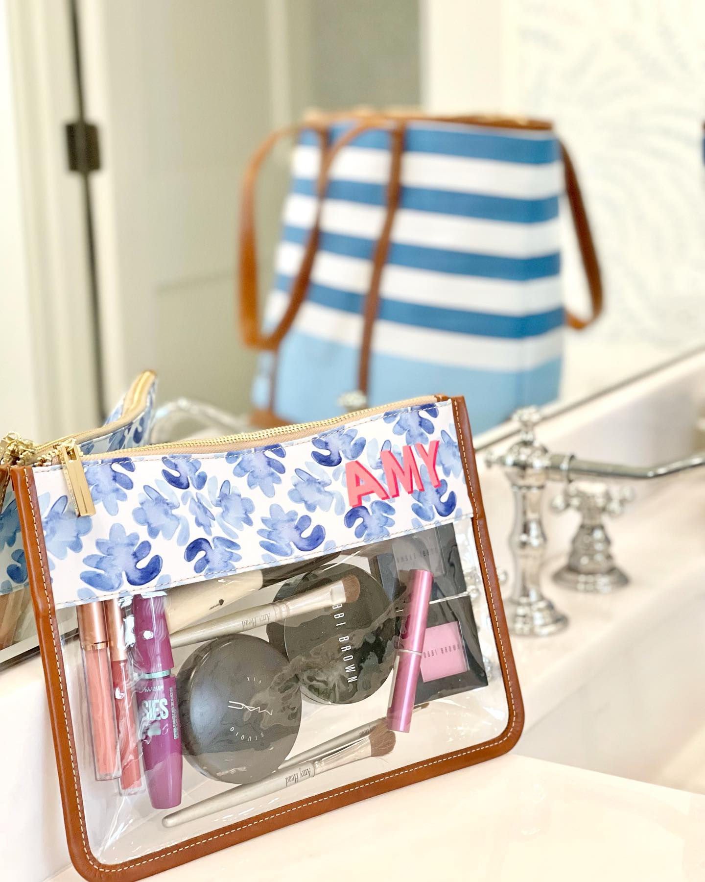 Clear Travel Pouch personalized with initials, showcasing its use for organizing travel essentials.